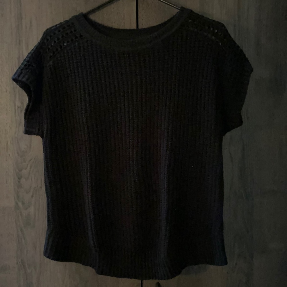 Black sweater.  Size M.... fits like a Large... maybe XL.